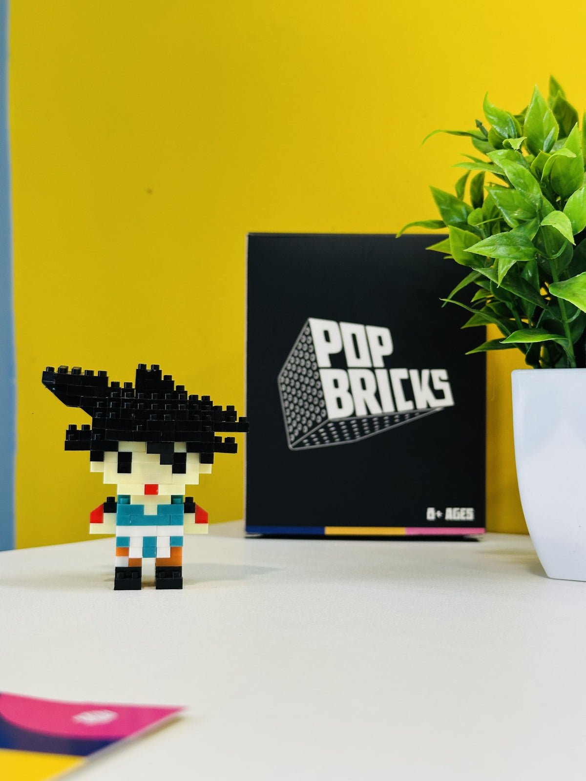 Front view of Vegeta Pop Bricks mini figure with branded packaging